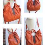 Large orange leather bag, pleated p..