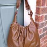 Large tan leather convertible backp..